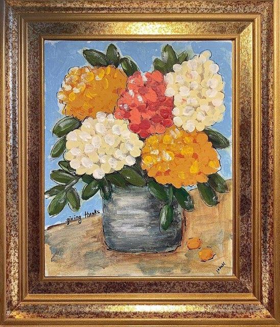 A vibrant painting of a vase filled with colorful flowers, elegantly displayed on a wooden table.