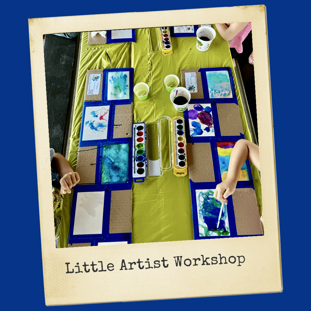 A cozy little artist workshop filled with colorful supplies, easels, and creative artwork in progress.